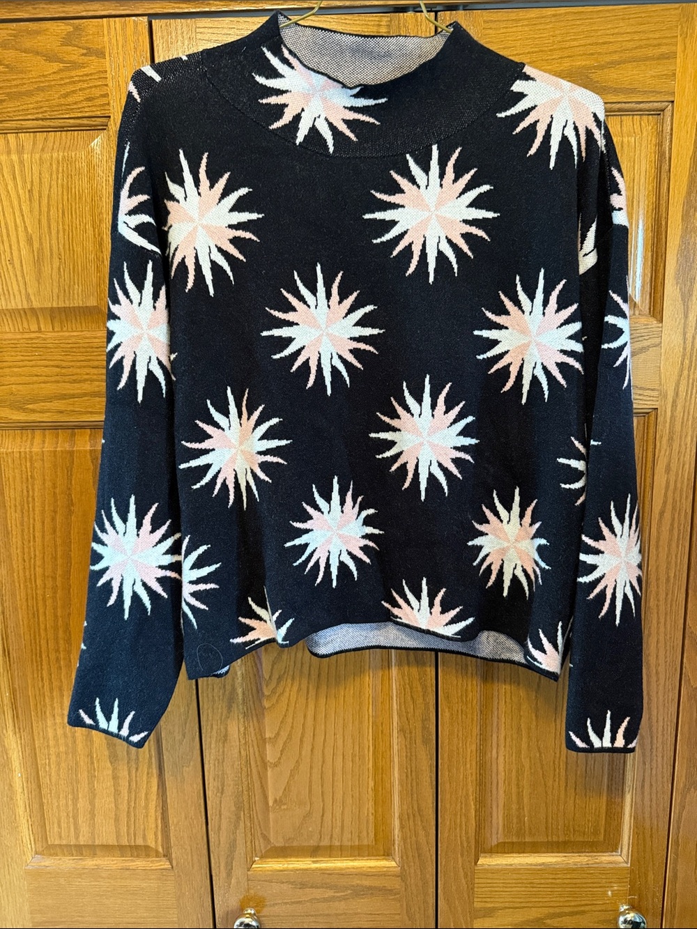 Maeve Black Crewneck Sweater with Pink and Cream Starburst